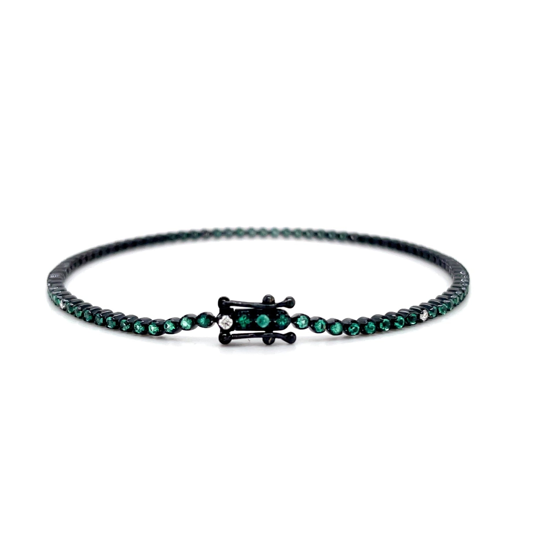 18kt witgouden zwart gerhodineerde tennis armband bezet met smaragd en diamant