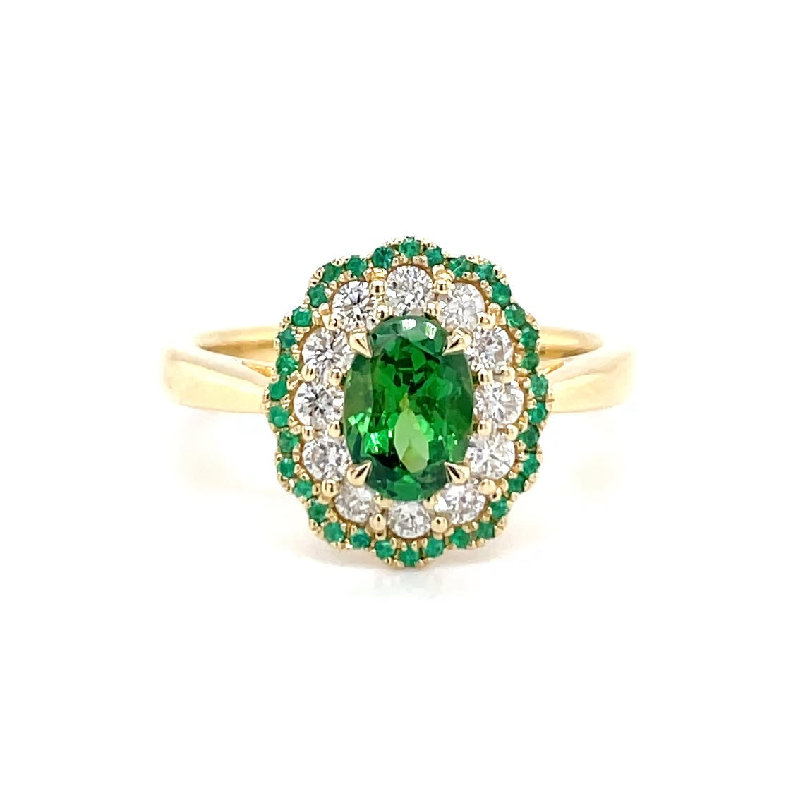 18kt geelgouden ring bezet met tsavoriet, smaragd en diamant.