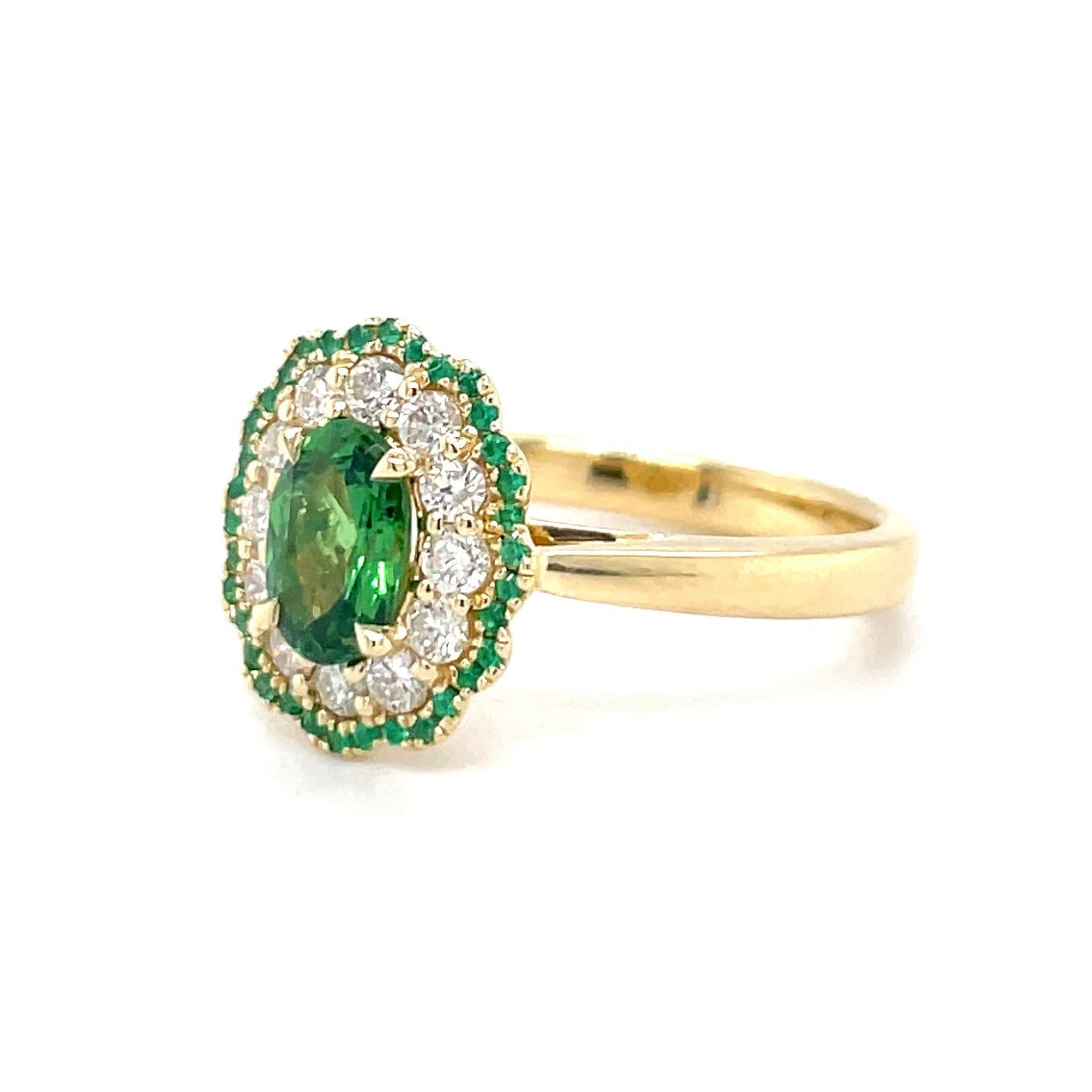 18kt geelgouden ring bezet met tsavoriet, smaragd en diamant.