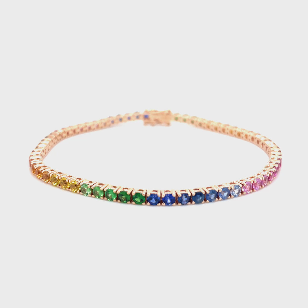 18kt rosegouden tennis armband bezet met regenboog saffier